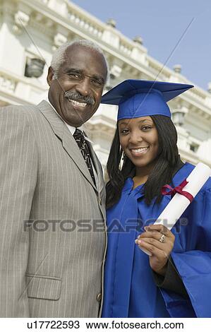 Graduate with father outside university, portrait View Large Photo Image Stock Image - Graduate with father outside university, portrait. Fotosearch