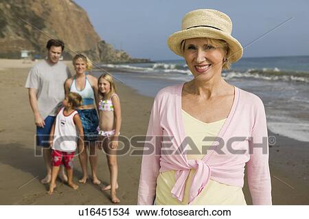 Picture - Grandmother with Family at Beach. Fotosearch