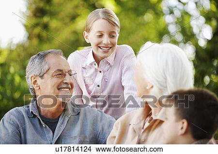 Picture - Grandparents with Grandchildren in back yard. Fotosearch
