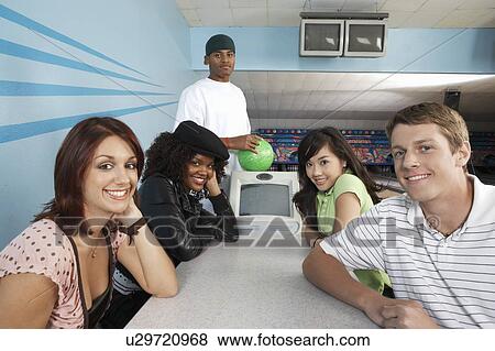 Group of friends at bowling alley, portrait View Large Photo Image Stock Photo - Group of friends at bowling alley, portrait. Fotosearch