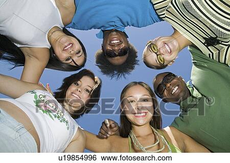group of friends in circle, view from below, portrait View Large Photo Image Stock Photograph - group of friends in circle, view from below, portrait. Fotosearch