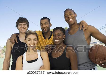 Stock Photo - Group of friends with basketball, portrait. Fotosearch