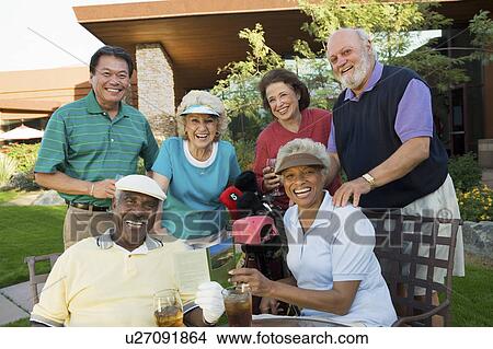 Group of senior golfers celebrating success, relaxing, (portrait) View Large Photo Image Picture - Group of senior golfers celebrating success, relaxing, (portrait). Fotosearch