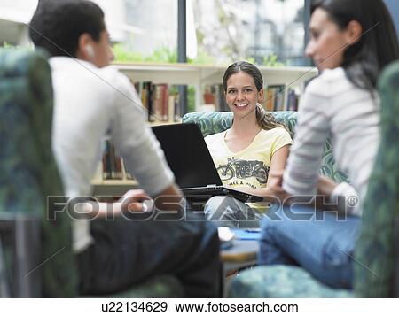 Group of teenagers talking in library View Large Photo Image Stock Photo - Group of teenagers talking in library. Fotosearch
