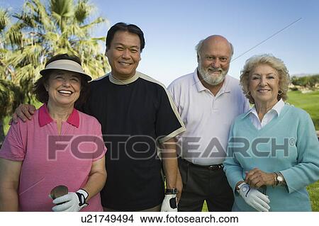 Picture - Group senior golfers on golf course, (portrait). Fotosearch