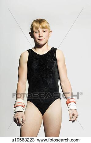 Gymnast (13-15) in leotard wearing palm guards, portrait View Large Photo Image Stock Image - Gymnast (13-15) in leotard wearing palm guards, portrait. Fotosearch