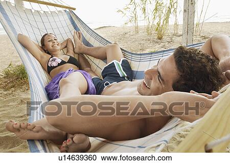 Happy Couple in Hammock on Beach View Large Photo Image Stock Image - Happy Couple in Hammock on Beach. Fotosearch