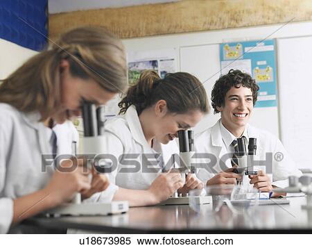 High school students using microscopes in classroom View Large Photo Image Stock Photography - High school students using microscopes in classroom. Fotosearch