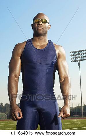 Stock Photography - Male athlete, half length, in stadium. Fotosearch