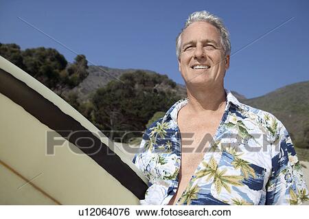 Male surfer smiling, outdoors View Large Photo Image Stock Photograph - Male surfer smiling, outdoors. Fotosearch