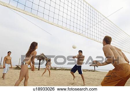 Man Hitting Volleyball during Game on Beach View Large Photo Image Stock Photograph - Man Hitting Volleyball during Game on Beach. Fotosearch
