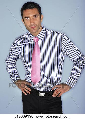 Stock Image - Man in shirt and tie, half length, in studio. Fotosearch