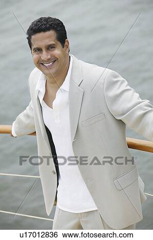 Stock Photograph - Man on Boat. Fotosearch