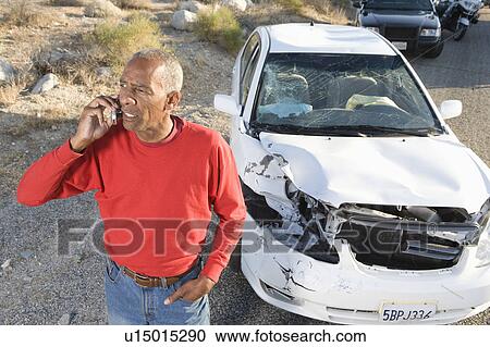Man on mobile following car accident View Large Photo Image Stock Image - Man on mobile following car accident. Fotosearch