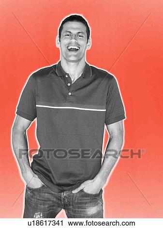 Stock Image - Man smiling in black and white on red background. Fotosearch