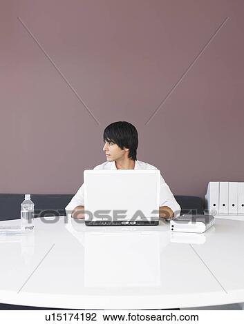 Man Using Laptop at White Table, profile View Large Photo Image Stock Image - Man Using Laptop at White Table, profile. Fotosearch
