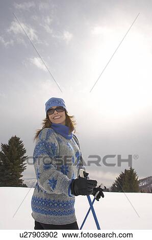 Mature woman skiing in field, half-length View Large Photo Image Stock Image - Mature woman skiing in field, half-length. Fotosearch