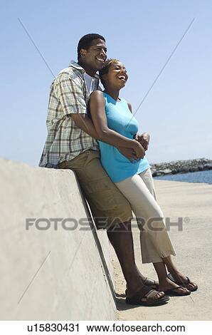 Middle-aged couple embracing at promenade View Large Photo Image Stock Image - Middle-aged couple embracing at promenade. Fotosearch