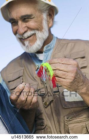 Middle-aged fisherman outdoors View Large Photo Image Stock Photography - Middle-aged fisherman outdoors. Fotosearch