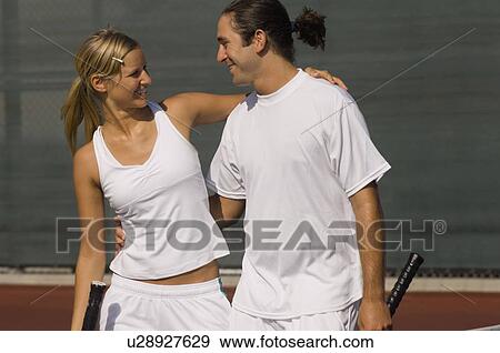 Mixed Doubles Partners standing on Court, arms around View Large Photo Image Stock Photo - Mixed Doubles Partners standing on Court, arms around. Fotosearch