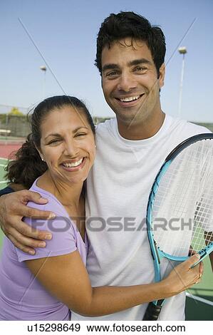 Mixed doubles Tennis Players on tennis court, portrait View Large Photo Image Stock Photo - Mixed doubles Tennis Players on tennis court, portrait. Fotosearch