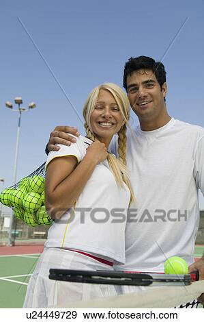 Mixed doubles Tennis Players on tennis court, portrait View Large Photo Image Stock Photo - Mixed doubles Tennis Players on tennis court, portrait. Fotosearch