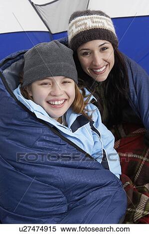 Mother and daughter (10-12) in tent, (portrait) View Large Photo Image Stock Photography - Mother and daughter (10-12) in tent, (portrait). Fotosearch