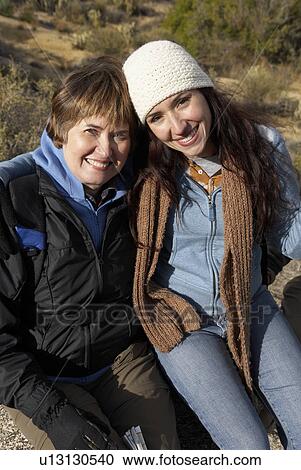 Mother and daughter in desert, (portrait) View Large Photo Image Stock Image - Mother and daughter in desert, (portrait). Fotosearch