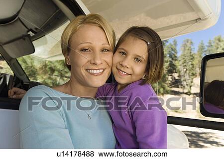 Mother and daughter sitting in RV View Large Photo Image Stock Photo - Mother and daughter sitting in RV. Fotosearch