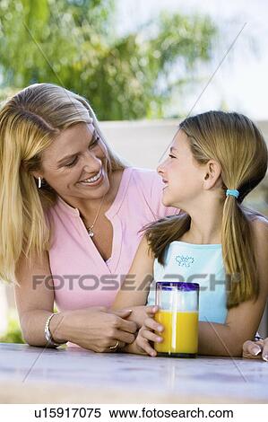 Mother and Daughter Sitting on Patio View Large Photo Image Stock Photography - Mother and Daughter Sitting on Patio. Fotosearch