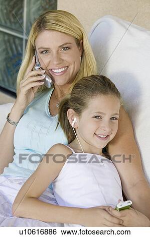 Mother and Daughter Sitting Together View Large Photo Image Stock Photograph - Mother and Daughter Sitting Together. Fotosearch