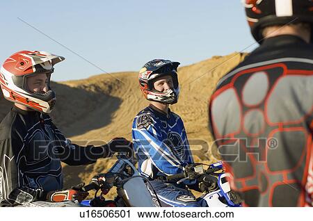 Motocross racers in desert View Large Photo Image Stock Image - Motocross racers in desert. Fotosearch