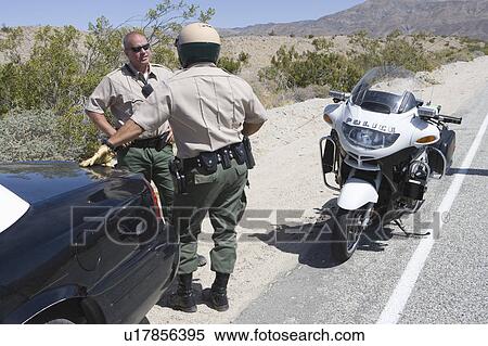 Motorcycle police officers with vehicles View Large Photo Image Stock Photography - Motorcycle police officers with vehicles. Fotosearch