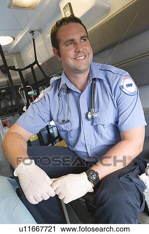 Stock Image - Paramedic in ambulance. Fotosearch