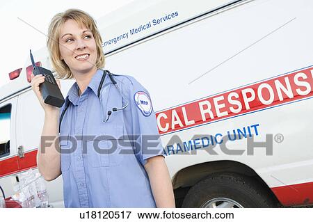 Paramedic with two-way radio View Large Photo Image Stock Photo - Paramedic with two-way radio. Fotosearch