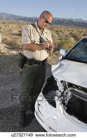 Police officer takes car crash details View Large Photo Image Stock Photo - Police officer takes car crash details. Fotosearch
