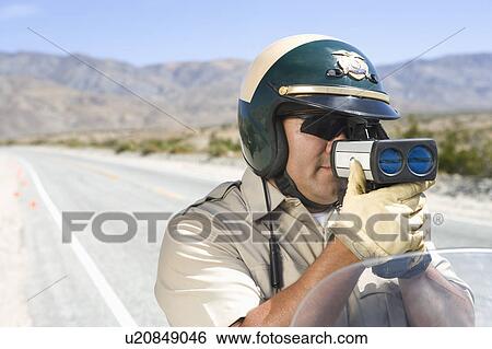 Policeman with speed radar View Large Photo Image Stock Photograph - Policeman with speed radar. Fotosearch