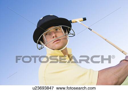Polo player preparing to swing View Large Photo Image Stock Photo - Polo player preparing to swing. Fotosearch
