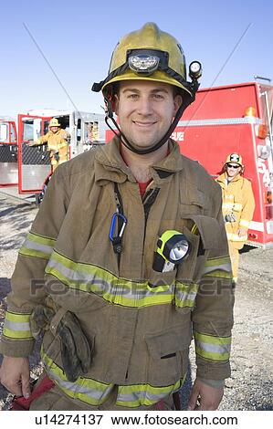 Stock Photo - Portrait of a fire fighter. Fotosearch