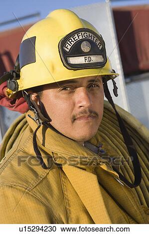 Stock Image - Portrait of a firefighter. Fotosearch