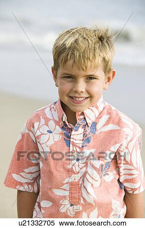 Portrait of boy on beach, smiling View Large Photo Image Stock Photography - Portrait of boy on beach, smiling. Fotosearch