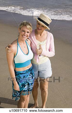Portrait of mother and daughter on beach View Large Photo Image Stock Image - Portrait of mother and daughter on beach. Fotosearch