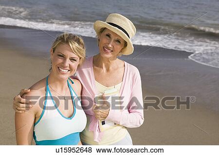 Portrait of mother and daughter on beach View Large Photo Image Stock Photo - Portrait of mother and daughter on beach. Fotosearch