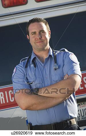 Portrait of paramedic by ambulance View Large Photo Image Stock Photo - Portrait of paramedic by ambulance. Fotosearch