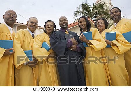 Preacher and Choir in church garden, portrait, low angle view View Large Photo Image Stock Image - Preacher and Choir in church garden, portrait, low angle view. Fotosearch