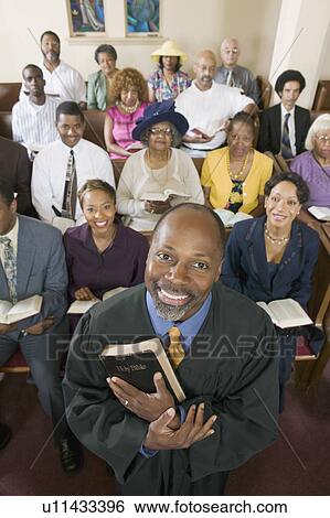 Stock Photograph - Preacher and Congregation, portrait, high angle view. Fotosearch