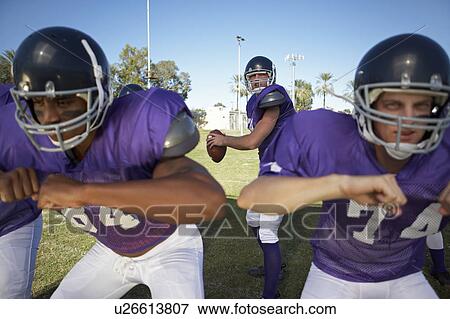 Quarterback Behind Linemen View Large Photo Image Stock Photo - Quarterback Behind Linemen. Fotosearch