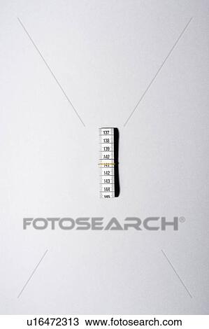 Roll of measuring tape with rubber band, view from above View Large Photo Image Stock Image - Roll of measuring tape with rubber band, view from above. Fotosearch