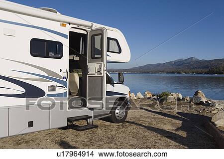 RV by a lake View Large Photo Image Picture - RV by a lake. Fotosearch