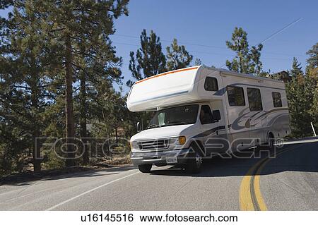 Stock Photograph - RV driving on mountain road. Fotosearch